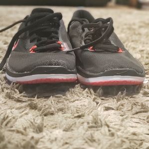 Bright pink and black Nike trainers